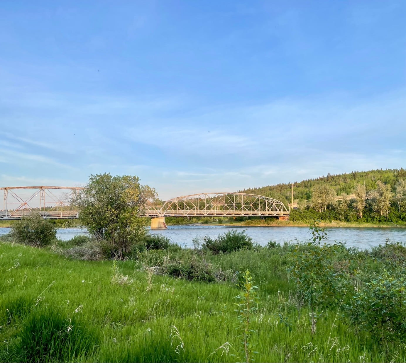 A picture of a river and a bridge going across that river.