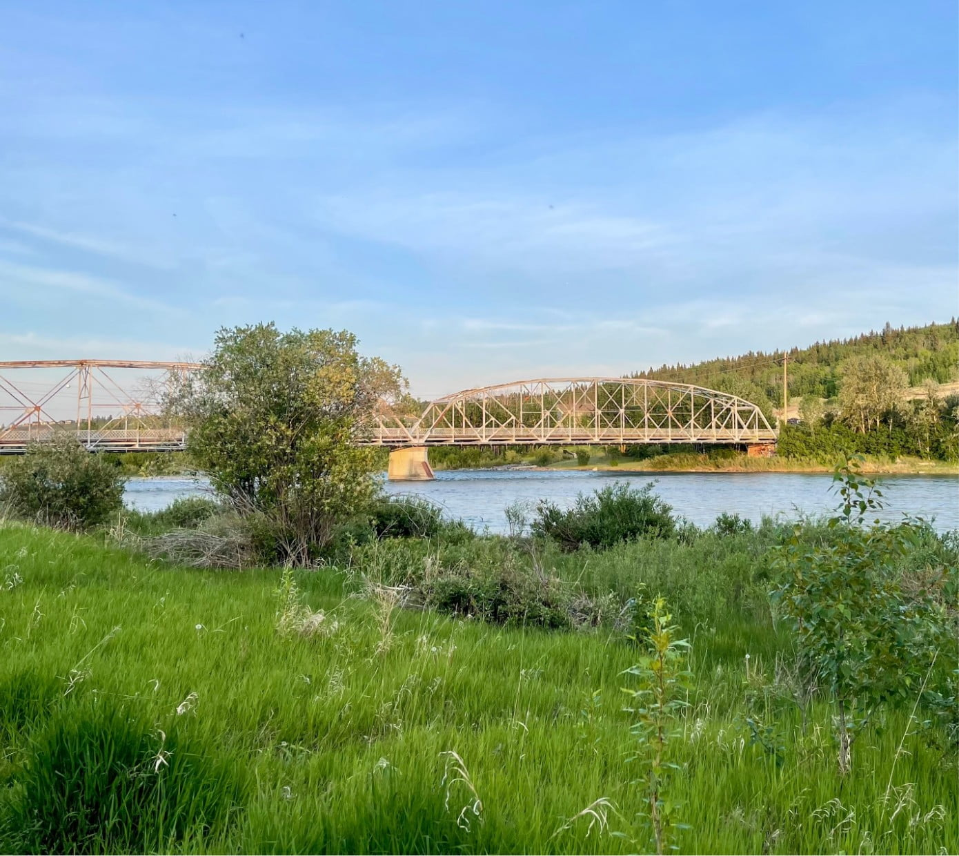 A picture of a river and a bridge going across that river.