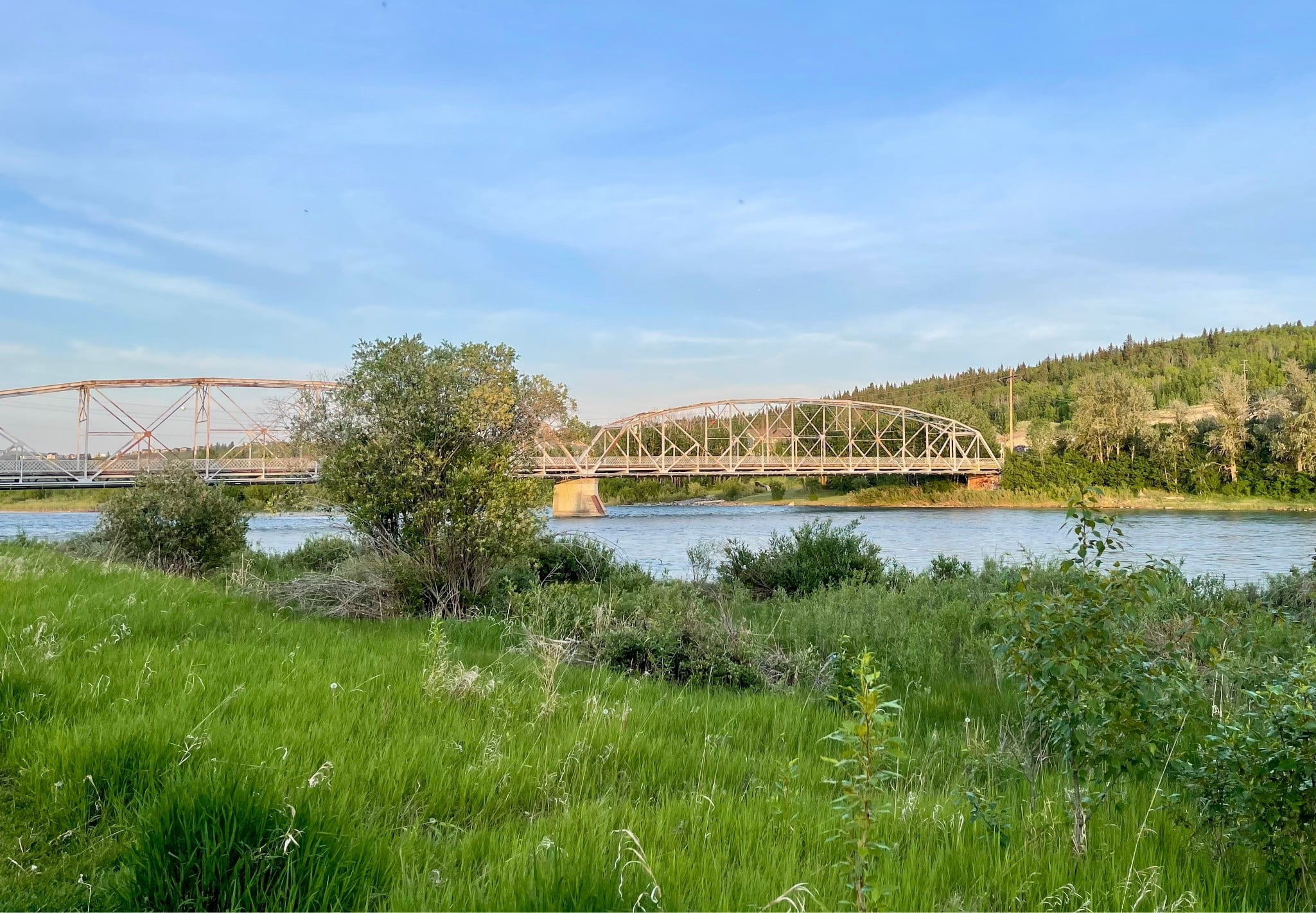 A picture of a river and a bridge going across that river.