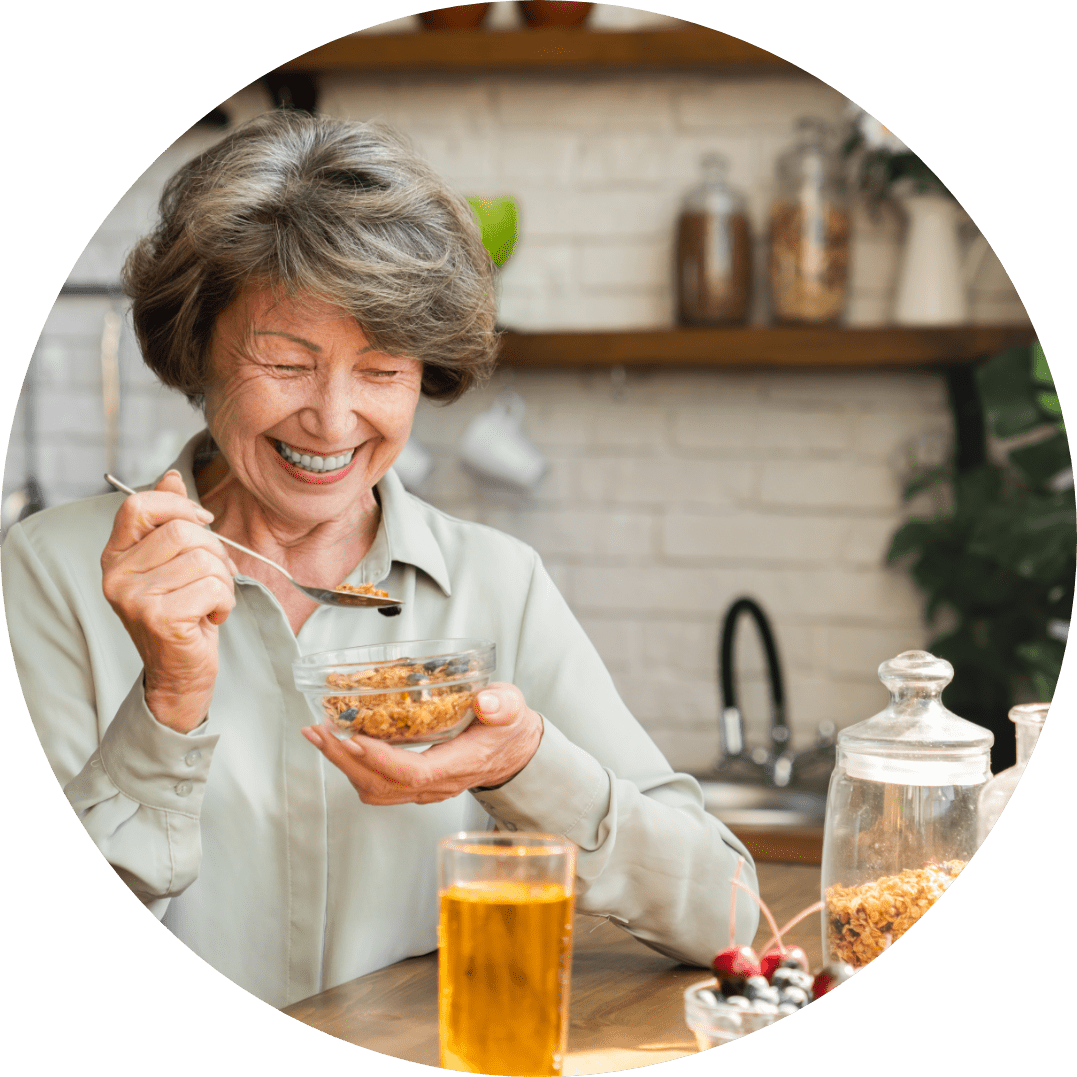 Elderly lady enjoying breakfast.